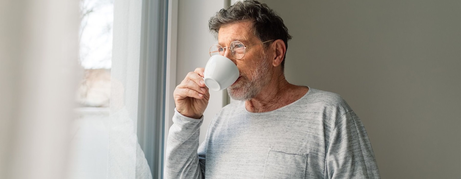 a man drinking from a cup