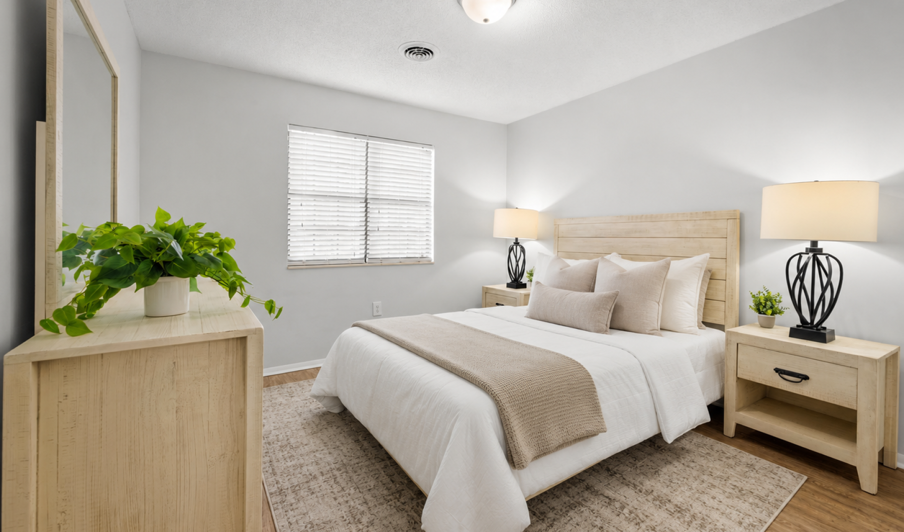 a bedroom with a bed and a rug
