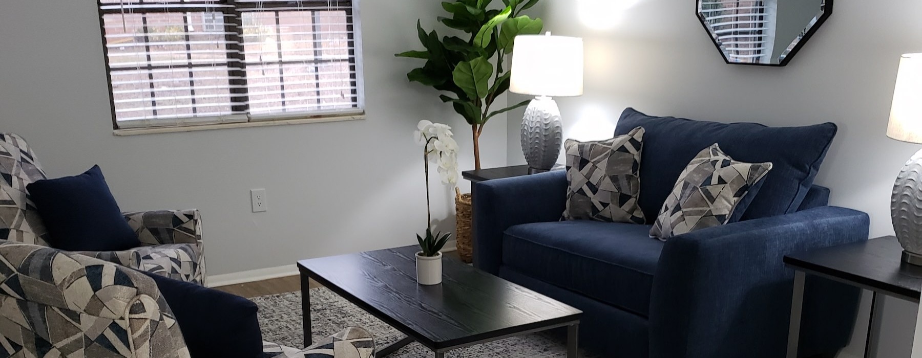 a living room with a chair and a couch