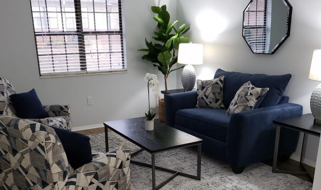 a living room with a chair and a couch